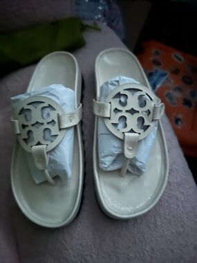 Tory Burch Cream Logo Thong Sandals with black platform.